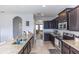 Well-appointed kitchen featuring granite countertops and stainless steel appliances at 10566 Green Ivy Ln, Orlando, FL 32832