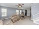 Cozy living room with a view of the kitchen and plenty of comfortable seating at 10566 Green Ivy Ln, Orlando, FL 32832