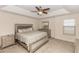 Spacious main bedroom featuring a ceiling fan, lots of light, and neutral colors for a relaxing feel at 10566 Green Ivy Ln, Orlando, FL 32832