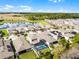 Drone shot capturing a beautiful home in a neighborhood near a pond and scenic landscape at 10699 Petrillo Way, Winter Garden, FL 34787