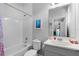 Bathroom showcasing a white vanity, a shower/tub combo, and modern fixtures at 10699 Petrillo Way, Winter Garden, FL 34787