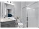 Bathroom boasts updated vanity, toilet, and glass door shower at 10699 Petrillo Way, Winter Garden, FL 34787