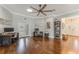 Bright home office featuring hardwood floors, crown molding, a ceiling fan, and French doors leading outside at 1094 Red Maple Way, New Smyrna Beach, FL 32168