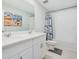 Well-lit bathroom with a double vanity and shower-tub combo at 125 Links Terrace Blvd, Daytona Beach, FL 32124