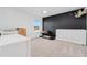 Bedroom featuring a black accent wall, a window view, and carpet flooring at 125 Links Terrace Blvd, Daytona Beach, FL 32124