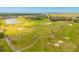 Aerial view of an immaculately maintained golf course surrounded by native landscaping at 125 Links Terrace Blvd, Daytona Beach, FL 32124