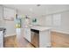 Kitchen island with stainless steel dishwasher and modern sink, open to the living area at 125 Links Terrace Blvd, Daytona Beach, FL 32124