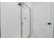 Modern bathroom shower features glass doors and white tile at 125 Links Terrace Blvd, Daytona Beach, FL 32124