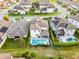 Aerial view of a house with pool and spa, complemented by landscaped yard at 1298 Patterson Ter, Lake Mary, FL 32746