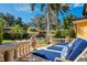 Backyard view showing the patio lounge area with elegant planters and palm trees at 1400 Alabama Dr, Winter Park, FL 32789