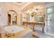 Elegant bathroom features a soaking tub, dual vanities, and decorative mirrors at 1400 Alabama Dr, Winter Park, FL 32789