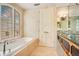 Elegant bathroom with soaking tub, and double sinks with granite countertops at 1400 Alabama Dr, Winter Park, FL 32789