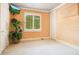 Empty bedroom features a plant, TV, window with shutters, and two closets at 1400 Alabama Dr, Winter Park, FL 32789