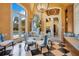 Bright breakfast nook features checkered floors, a round glass table, and views of the pool at 1400 Alabama Dr, Winter Park, FL 32789