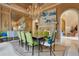 Elegant dining room featuring a chandelier, fireplace, and archway leading to a sitting room at 1400 Alabama Dr, Winter Park, FL 32789