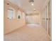 Large dressing room with built-in closet systems, mirrored wardrobe doors, and carpeted floors at 1400 Alabama Dr, Winter Park, FL 32789