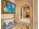 Hallway with archways to rooms and decorated with art at 1400 Alabama Dr, Winter Park, FL 32789