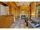 Luxurious living room featuring a fireplace, wood paneling, a decorative floor, and sophisticated furnishings at 1400 Alabama Dr, Winter Park, FL 32789