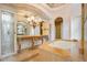 Main bathroom featuring an ornate vanity, a soaking tub, and a decorative mirror at 1400 Alabama Dr, Winter Park, FL 32789