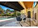 Covered outdoor dining area with adjacent pool featuring stone floors and wood ceilings at 1400 Alabama Dr, Winter Park, FL 32789