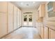 Well-lit room with custom cabinets, marble countertops, and French doors that open to the outdoors at 1400 Alabama Dr, Winter Park, FL 32789