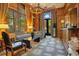 Sitting room with wood walls, a chandelier, patterned furniture, and large windows at 1400 Alabama Dr, Winter Park, FL 32789