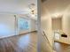 Upstairs view of the bright living room, showcasing the wood look flooring at 1609 River Birch Ave, Oviedo, FL 32765