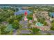 Aerial view of community with lake access, a pool, and lush landscaping at 200 Maitland Ave # 12, Altamonte Springs, FL 32701