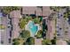 Aerial view of a community pool surrounded by lush landscaping and multi-story buildings at 200 Maitland Ave # 12, Altamonte Springs, FL 32701