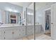 Bathroom featuring a double sink, mirror and stall shower at 200 Maitland Ave # 12, Altamonte Springs, FL 32701