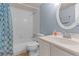 Bathroom featuring a white vanity, mirror, and blue shower curtain at 200 Maitland Ave # 12, Altamonte Springs, FL 32701