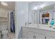 Bathroom with white vanity and mirror, toilet and stall shower at 200 Maitland Ave # 12, Altamonte Springs, FL 32701