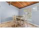 Bright dining area featuring a table with seating for six, wood floors, and natural light at 200 Maitland Ave # 12, Altamonte Springs, FL 32701