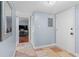 Hallway with neutral tile flooring leading to doorway of an adjacent room at 200 Maitland Ave # 12, Altamonte Springs, FL 32701