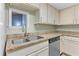 Kitchen area featuring stainless sink, granite counters and a window looking into a dining area at 200 Maitland Ave # 12, Altamonte Springs, FL 32701