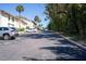 Wide view of parking near residential buildings with water access in the distance at 200 Maitland Ave # 12, Altamonte Springs, FL 32701