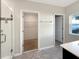 Bright bathroom featuring tiled floors, glass enclosed shower, and a walk-in closet at 2015 Sloans Outlook Dr, Groveland, FL 34736