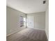 Bedroom with large closet doors and a bright window adding natural light to the space at 2015 Sloans Outlook Dr, Groveland, FL 34736