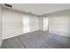 Carpeted bedroom featuring neutral walls and bright natural light at 2015 Sloans Outlook Dr, Groveland, FL 34736