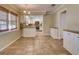 Bright dining room with tiled floors, a view into the kitchen, and a charming chandelier at 2055 Jessamine Ct, Deltona, FL 32738