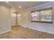 Entryway with tiled floors, a double-door closet and a window with woven shades at 2055 Jessamine Ct, Deltona, FL 32738