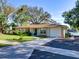 Inviting single-story home featuring a driveway, attached garage, and lush front yard at 2055 Jessamine Ct, Deltona, FL 32738