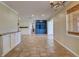 Bright and open living room with tiled floors and a view of blue built-in bookshelves at 2055 Jessamine Ct, Deltona, FL 32738