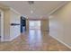 Bright and open living room with tiled floors and crown molding throughout at 2055 Jessamine Ct, Deltona, FL 32738