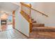 View of a carpeted staircase inside the home with a peek at the fireplace in the living room at 2201 Coach House Blvd # 3, Orlando, FL 32812