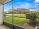 View from the screened in sunroom over looking the greenery and the water at 2230 Cascades Blvd # 104, Kissimmee, FL 34741