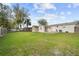 Expansive backyard with lush green lawn, shed, and patio, perfect for outdoor activities at 2260 Danforth Ave, Deltona, FL 32738