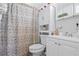 Functional bathroom featuring a vanity with storage, neutral fixtures, and a patterned shower curtain at 2260 Danforth Ave, Deltona, FL 32738