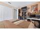 Cozy bedroom showcasing a large bed, desk, and natural lighting, creating an inviting retreat at 2260 Danforth Ave, Deltona, FL 32738