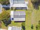 Aerial view of a home showcasing the roof, driveway, and surrounding yard at 2706 Cranmoor Dr, Kissimmee, FL 34758